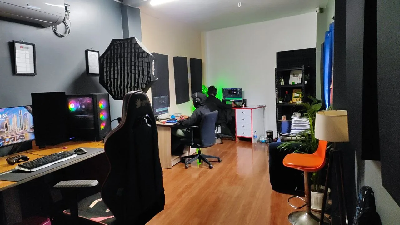 The BiznzUp studio: editing and design workstations with the team at work.